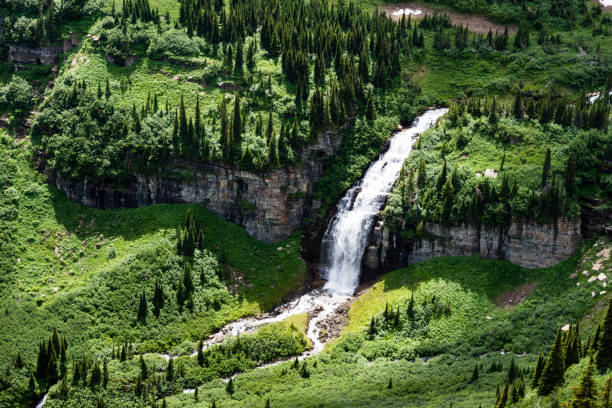 Waterfall under Logan Pass along Going-to-the-Sun Road in Glacier National Park, Montana, USA stock photo