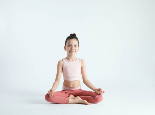istock Cute Girl Doing Yoga 1407744453