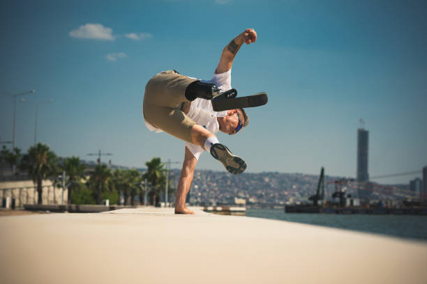 istock Amputee atlete jumping over wall 1407745355