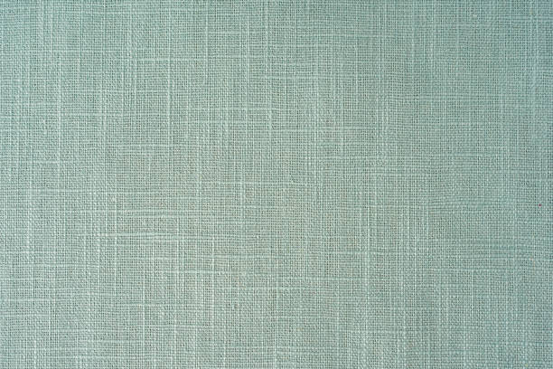 istock mint green fabric texture background, pattern. Abstract design background of linen sack textile canvas burlap cloth. Close-up, mock up, top view 1407748658