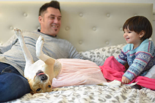 istock father with his son and his dog 1407759860