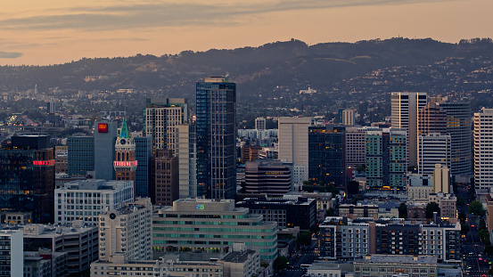 Aerial shot of Downtown Oakland, California at sunset on a summer evening.