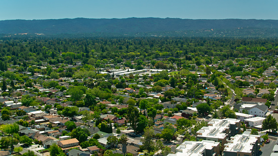 Aerial establishing shot of Menlo Park, California on a clear and sunny summer day. Menlo Park is one of many towns in Silicon Valley in the greater San Francisco Bay area.\n\nAuthorization was obtained from the FAA for this operation in restricted airspace.