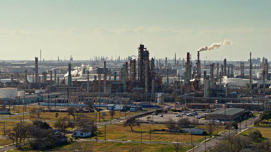 Aerial shot of an oil refinery in Corpus Christi, a port city on the Gulf of Mexico in Nueces County, Texas. Residential streets go right up to the edge of the facility. 

Authorization was obtained from the FAA for this operation in restricted airspace.