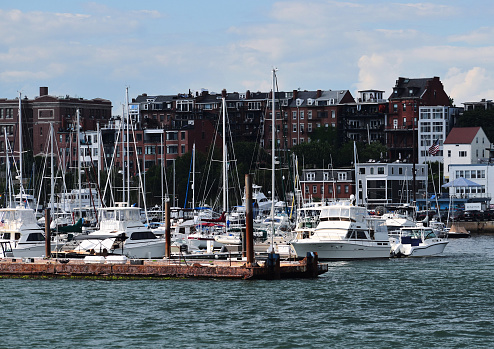 Several various ships parked along Boston Harbor