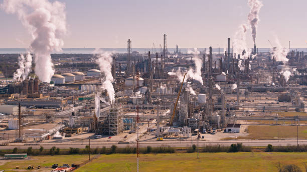 istock Distillation Towers and Smoke Stacks at Texas oil Refinery 1407762496