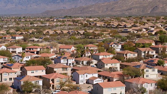 Aerial shot of housing in Vail, a suburb southeast of Tucson in Pima County, Arizona on a hazy day in spring.