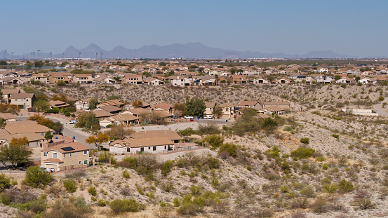 Aerial shot of housing in Vail, a suburb southeast of Tucson in Pima County, Arizona on a hazy day in spring.