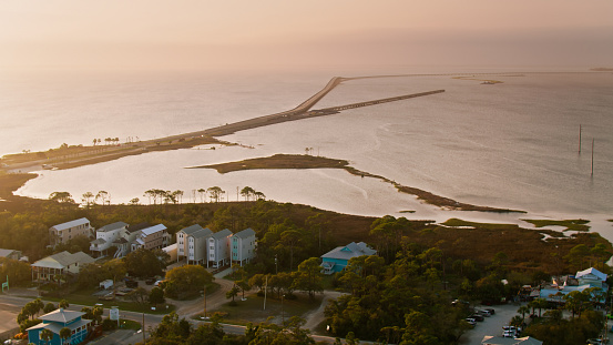 Aerial shot of St. George Island, Florida at sunset. St George is a small town known for its beaches and resorts.