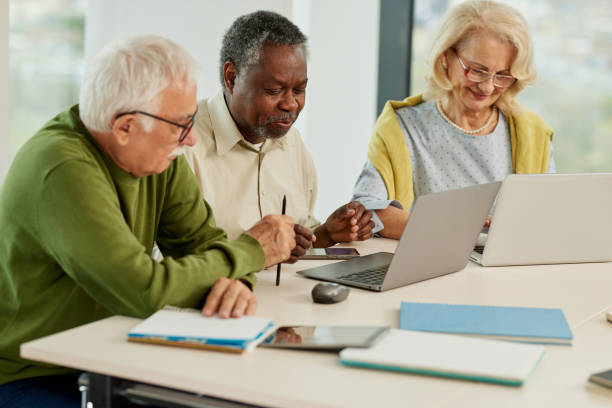 istock A cheerful multicultural group of senior students is doing an assignment on laptops in the classroom. 1407766749