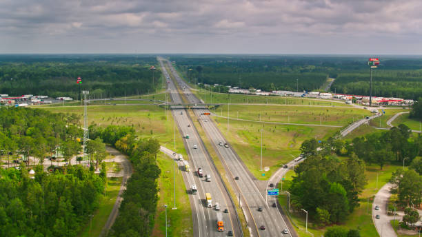 Aerial View of Interstate 95 and Rest Area in Georgia Aerial shot of rest area just outside Kingsland, Georgia on an overcast afternoon in spring. georgia us state photos stock pictures, royalty-free photos & images