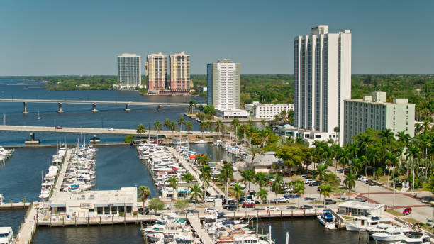 Marina and Riverfront in Fort Myers, FL Aerial shot of Fort Myers, a city in Lee County, Florida, on a sunny day in spring.  

Authorization was obtained from the FAA for this operation in restricted airspace. fort myers stock pictures, royalty-free photos & images