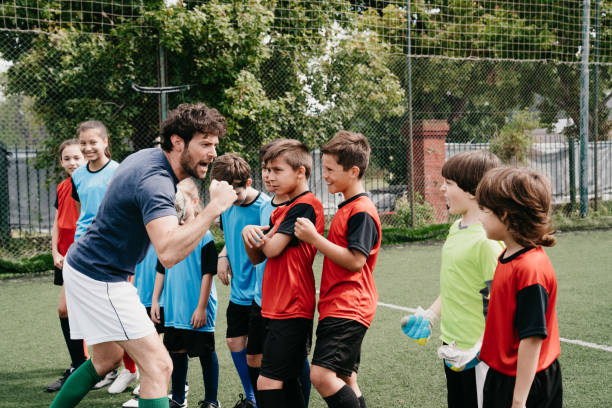 istock Coach encouraging kids on a soccer field 1407767773
