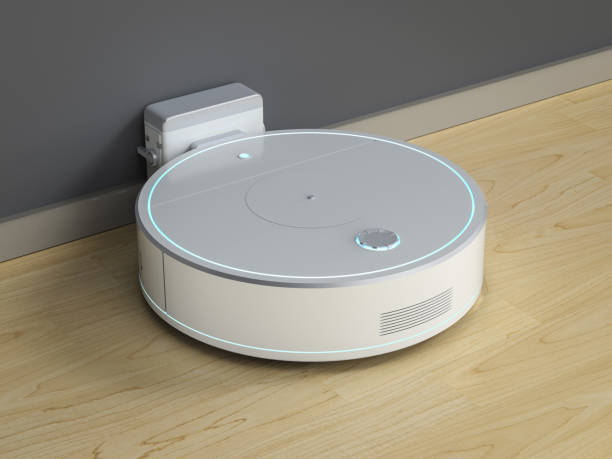 istock Robotic vacuum cleaner or sweeper at charging station 1407768043