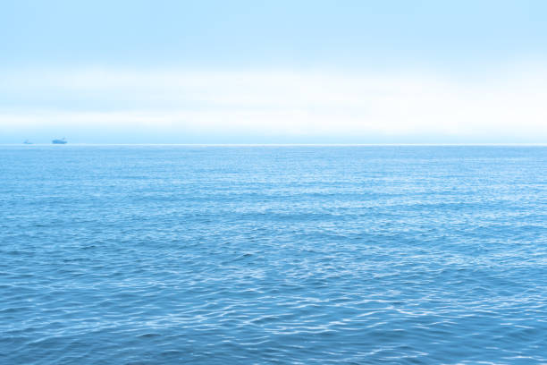 istock Nature background with blue sea against cloudy sky 1407768460