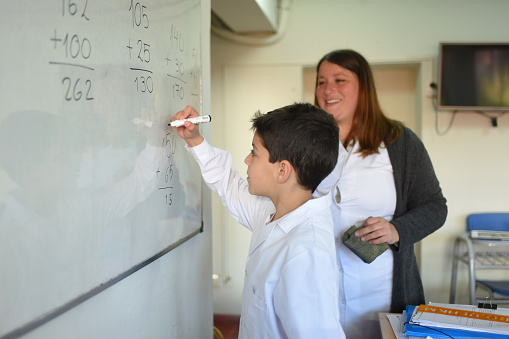 Students with their teacher in the classroom