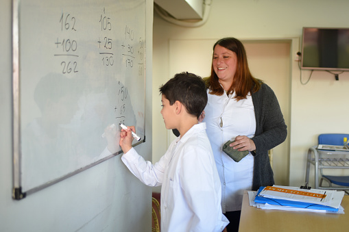 Students with their teacher in the classroom