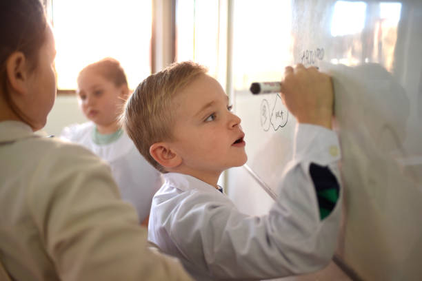 istock children writing on the school board 1407770133