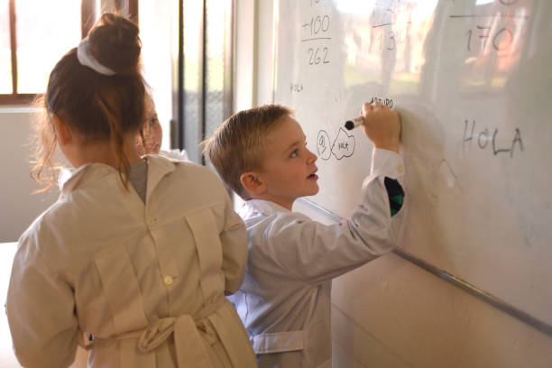 istock children writing on the school board 1407770135