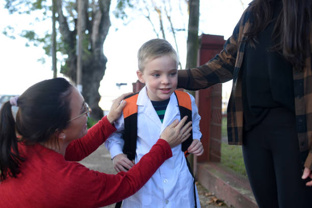 istock children arriving at school with their parents 1407771577