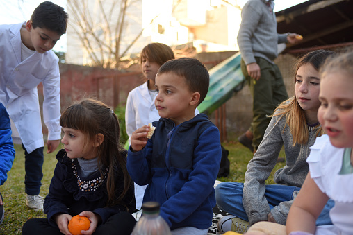 Group of children eating a snack