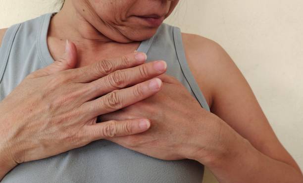 istock Gesture the hands touching on her chest. 1407778279