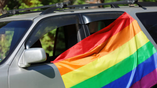 istock Rainbow flag on car. LGBT concept. 1407784524