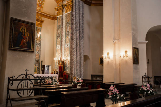 istock wooden benches in a catholic church interior 1407785480