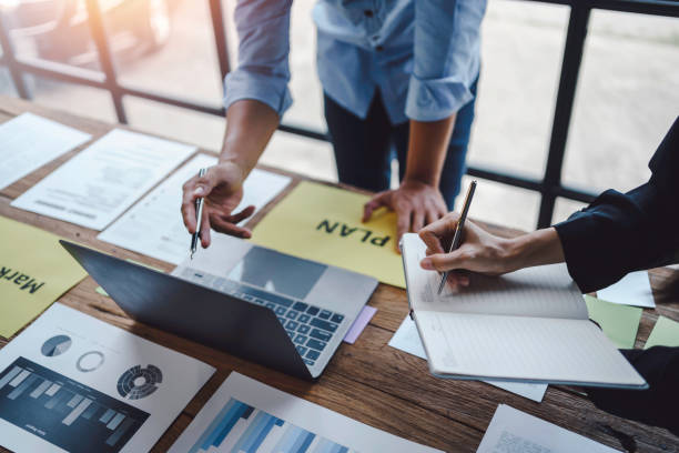 istock Business people discuss investment project working and planning strategy on laptop computer. Business meeting talking, planning analyze investment and marketing in office. 1407787219