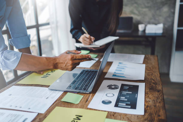 istock Business people discuss investment project working and planning strategy on laptop computer. Business meeting talking, planning analyze investment and marketing in office. 1407787220