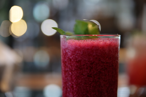 A nice glass of beetroot and berry juice with smooth bokeh