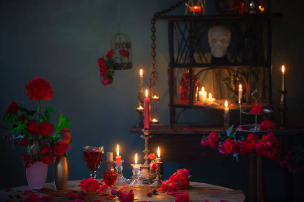 istock magic potion with red roses and burning candles in dark room 1407789134