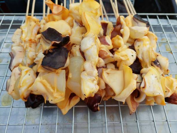 istock Grilled squid or octopus at Thai seafood market 1407789355