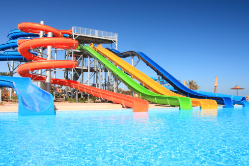 Colorful waterpark tubes and pool in tropical aquapark. Egypt, Sharm al-Sheikh.