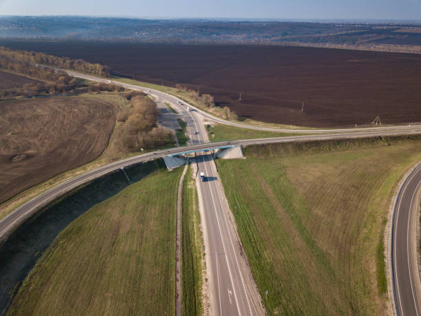 istock Aerial Top View of highway intersection junction summer morning 1407791296