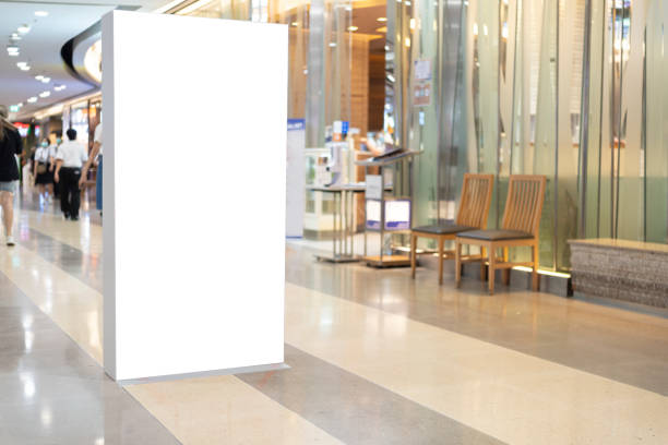 istock blank showcase billboard or advertising light box for your text message or media content with escalator in modern department store shopping mall, shopping center 1407792217