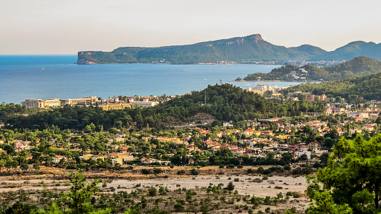 Panoramic view of Goynuk town in Antalya province in Turkey. In the distance at the cape - the city of Kemer