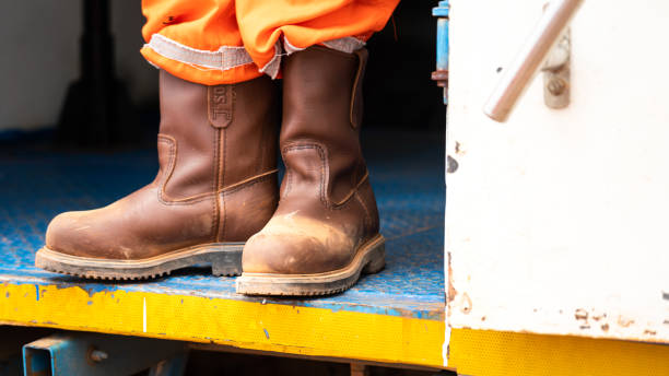 istock A worker is wearing safety shoe  - Industrial working. 1407799203
