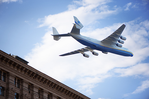 Kyiv, Ukraine - August 23, 2021: Airplane Antonov An-225 Mriya flying over Khreshchatyk street on rehearsal of the military parade. Strategic airlift cargo aircraft, biggest plane in the world