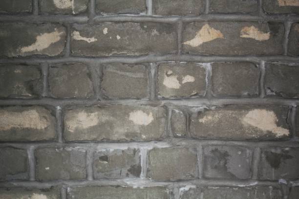 ladrillo gris textura de pared de yeso brillante estuco cemento pared loft fondo - retro revival pattern masonry old fotografías e imágenes de stock