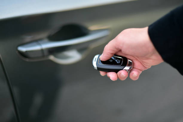istock A woman holds a pop-up car key in her hand 1407807774