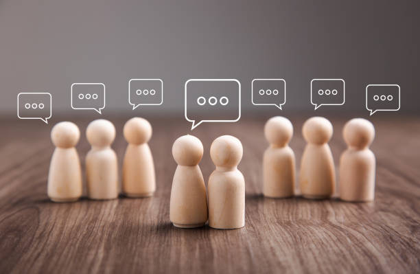 istock Wooden figurine with speech bubble. Mingle, discussion, chatting concept 1407807979