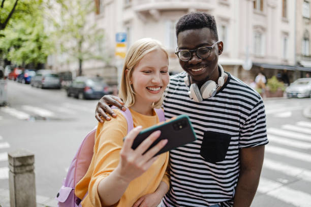 istock Young people taking selfie on the street 1407814553