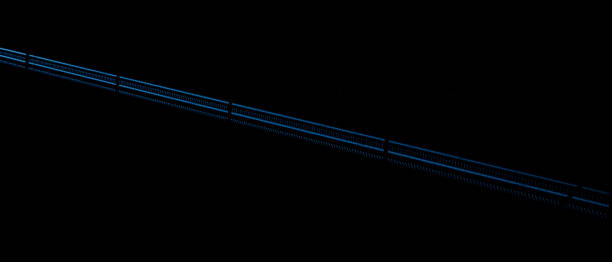 istock blue car lights at night. long exposure 1407816328