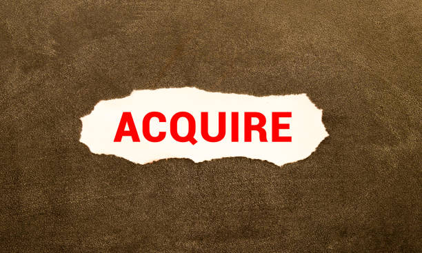 istock word Acquire on torn paper, business concept 1407816535