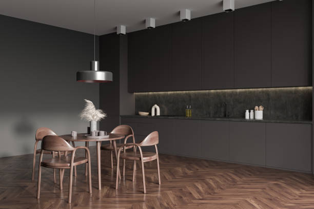 istock Grey kitchen interior with eating table and seats on wooden floor 1407817719