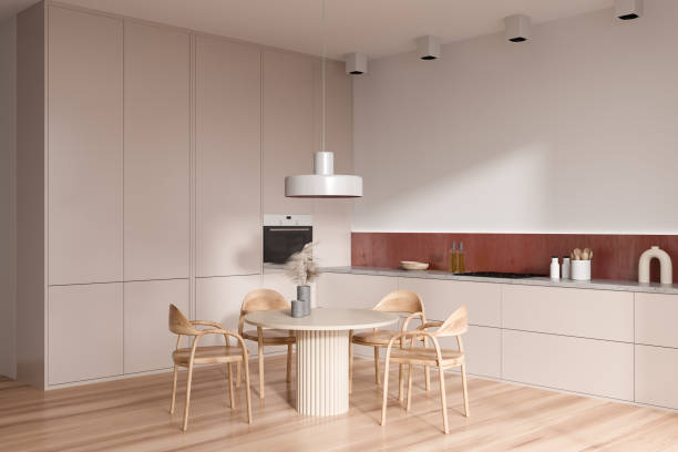 istock Light kitchen interior with eating table and seats, shelves and kitchenware 1407817748