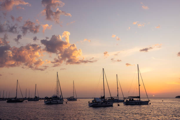 Beautiful Istrian (Croatia) sea sunset landscape. Silhouetted boats in a foreground
