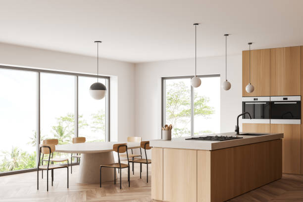 istock Stylish kitchen interior with chairs and island, eating space and panoramic window 1407818813