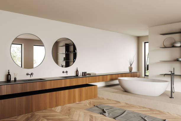istock Light bathroom interior with sink and bathtub, towel and accessories 1407818985